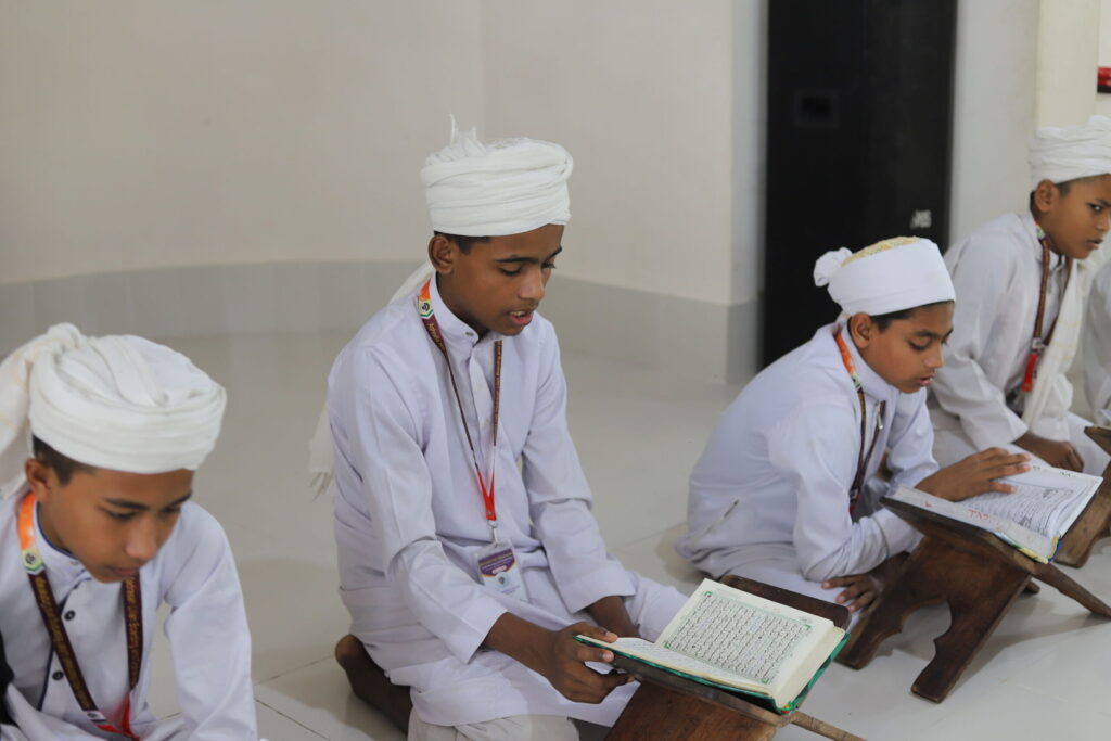 orphanage students reading the Quran at Ashrafia Madrasah