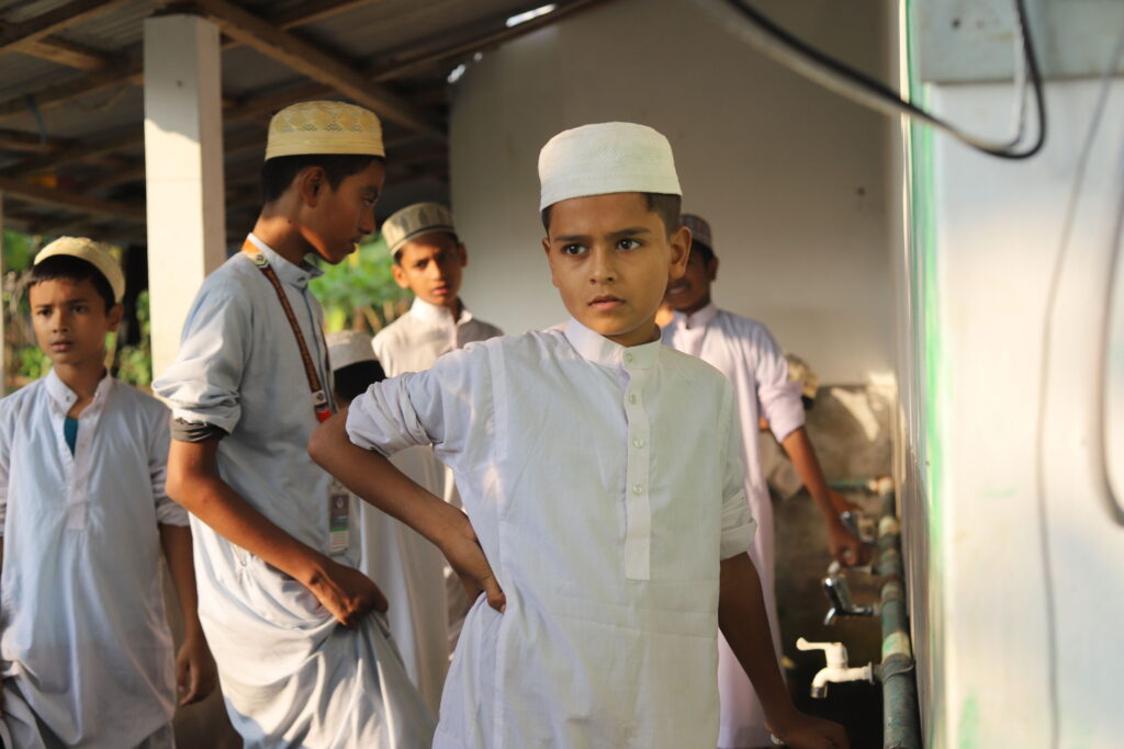 students performing wudu for prayer